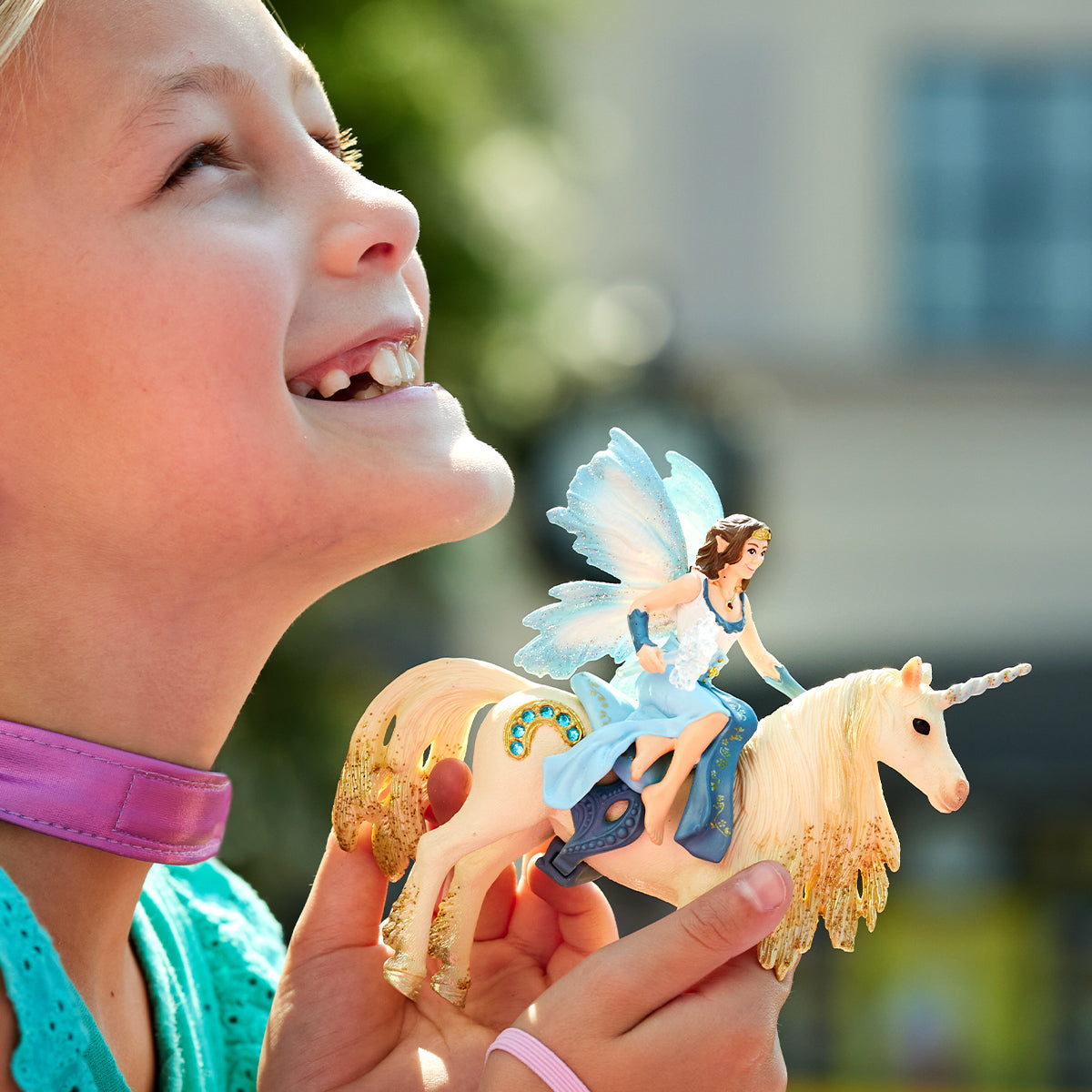 Eyela riding on golden unicorn