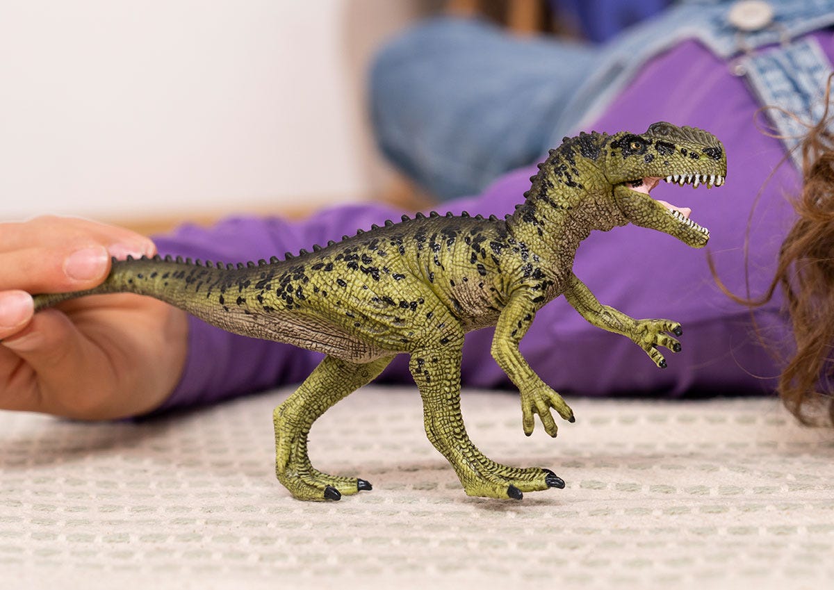 T rex online and monolophosaurus toy